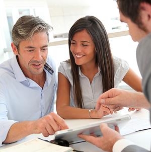 Couple looking at floor plan or efloorplan